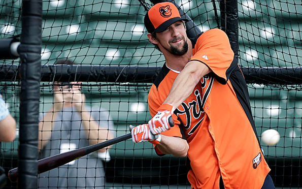 Michael Phelps takes batting practice with Orioles