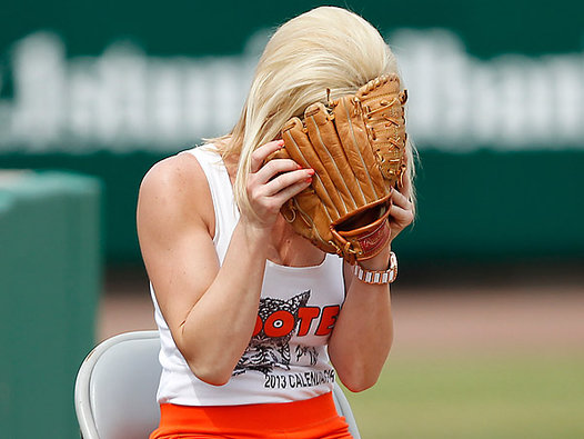 Incoming! Hooters ball girl has embarrassing encounter with foul ball (again)