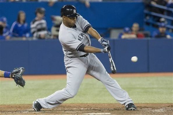 Wells paces offense as Yanks top Jays in 11