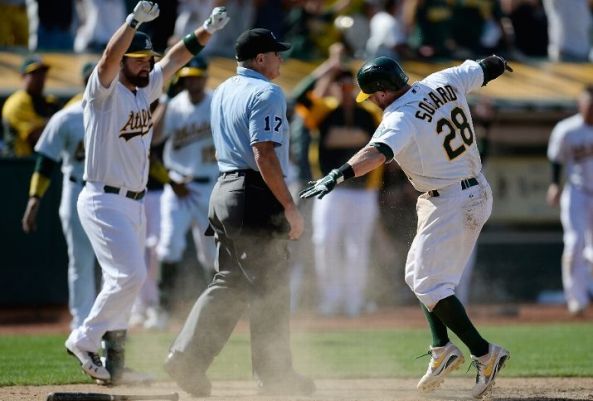 A's win with small ball in extras after Cespedes' HR