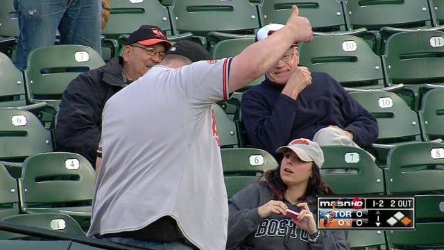 Dad shields daughter from foul ball