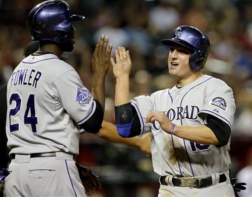Rockies ride timely hitting, 'pen to win in Arizona