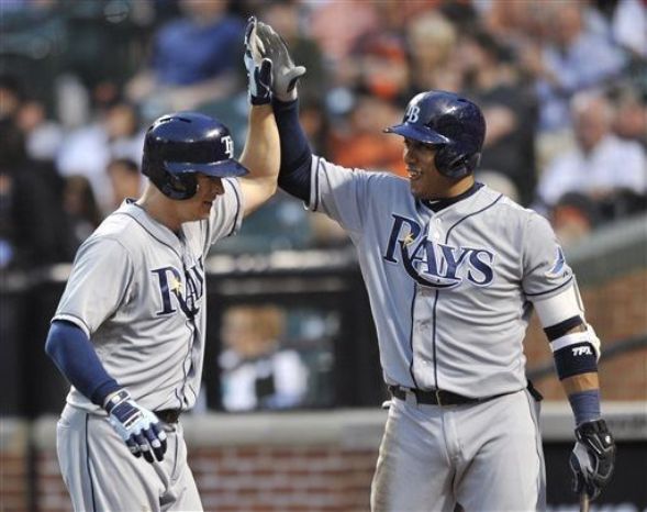 Johnson powers Rays to 12-10 win over Orioles