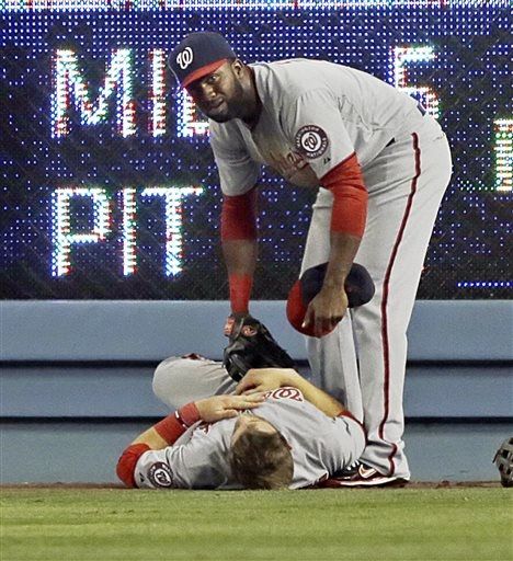 Bryce Harper exits game after violent collision with wall (Video)