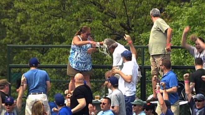 Cubs fan tries to protect wife from home run ball, wife dumps beer on his head