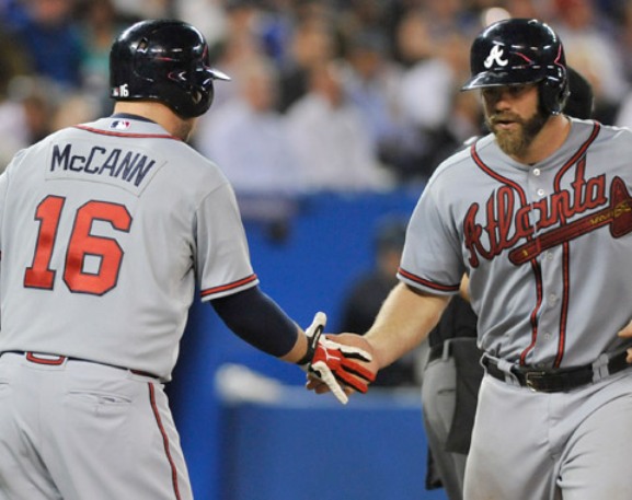 McCann's 2 HRs, shot in 10th leads Braves over Jays 7-6