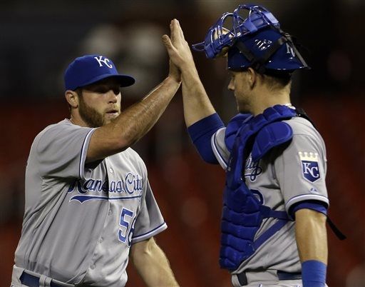 Royals wait out rain to complete late comeback