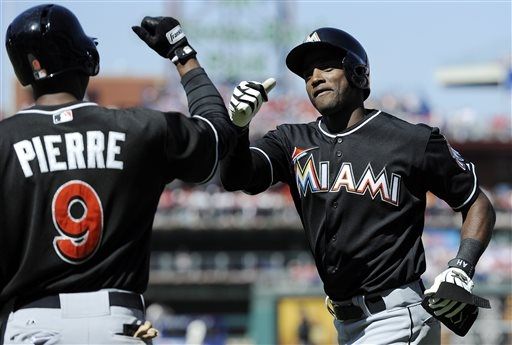Hechavarria has 7 RBIs, Marlins rout Halladay 14-2 