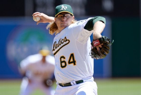 Griffin gets first win in month, A’s beat Reds 5-0