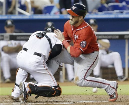 Bryce Harper bowls over Mathis at home plate (Video)