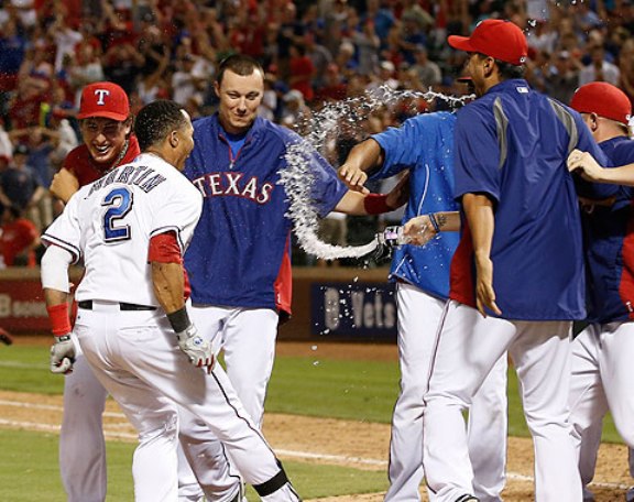 Martin homers in 10th as Rangers beat Angels 14-11