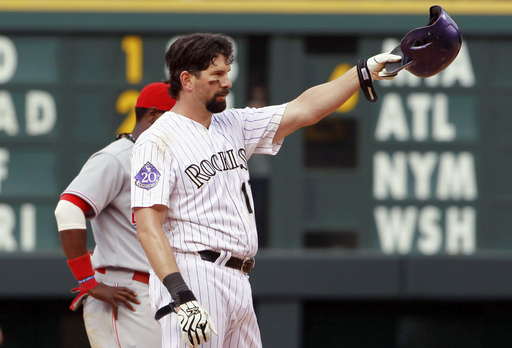 Helton reaches 2,500 hits as Rockies beat Reds 7-4