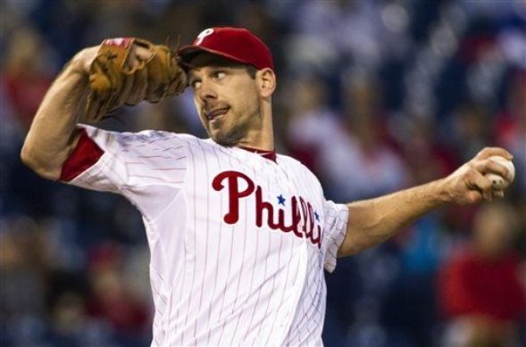 Lee uses arm and bat to help Phillies beat Marlins 12-2