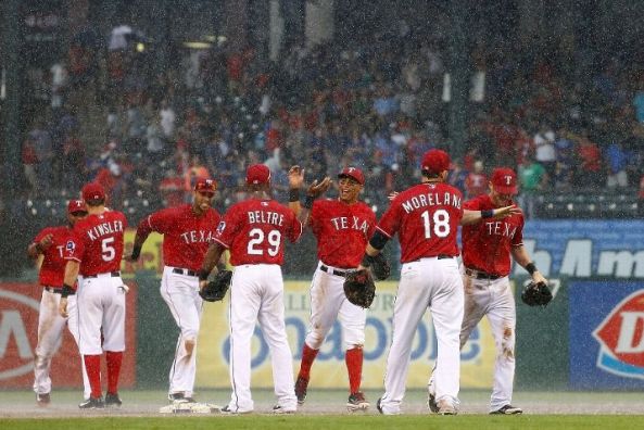 Rangers beat Angels 7-4, still in playoff chase
