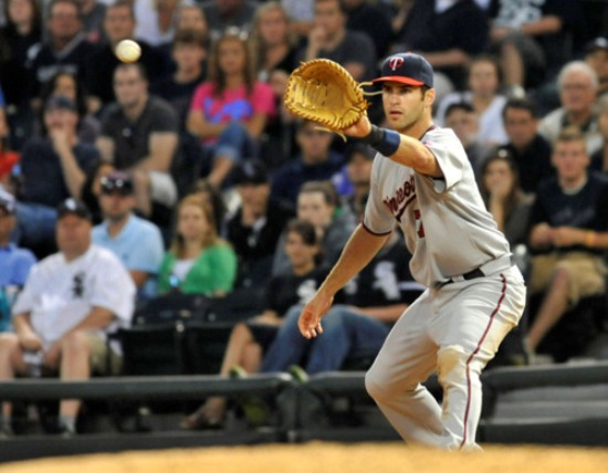 Joe Mauer gives up catching, will play 1B in '14