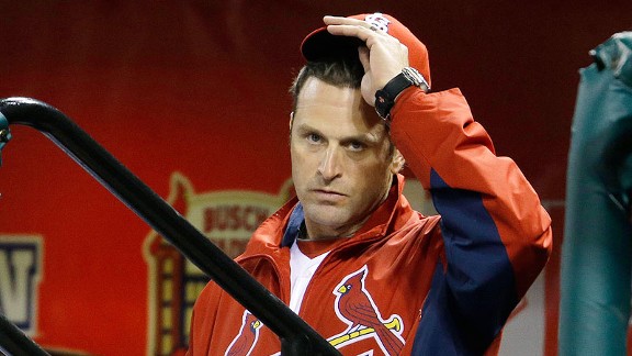 St. Louis Cardinals manager Mike Matheny cleans clubhouse toilets