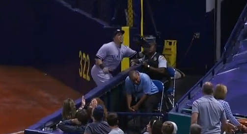 Carlos Beltran tumbles over wall going after foul (Video)
