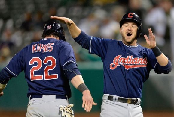 Indians rally in 9th to split doubleheader with A's