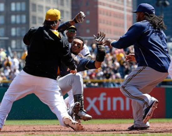 Brewers win in 14th after early brawl with Pirates