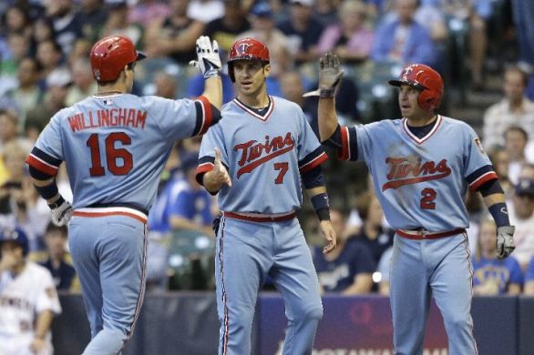 Twins beat Brewers, game delayed when fan falls