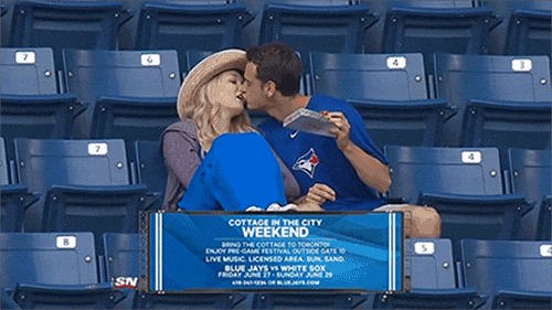 Blue Jays fan has mouth full of pizza, kisses girlfriend, gets denied (GIF)