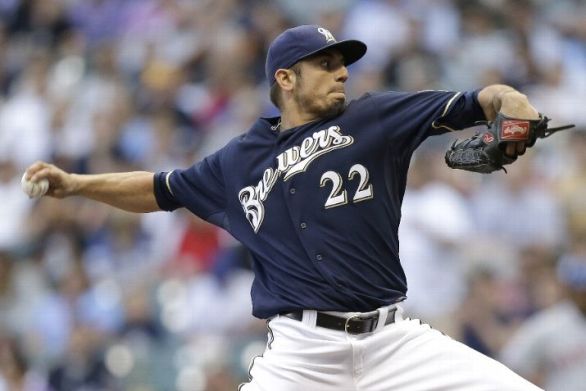 Brewers pile on runs to back Garza's solid effort