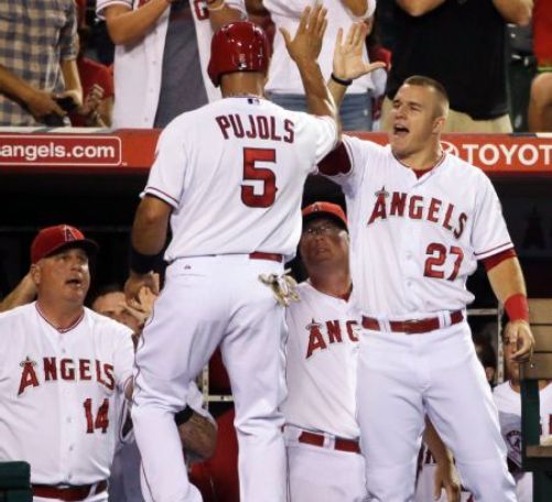 Angels use 8 pitchers to beat A's 2-0, extend lead