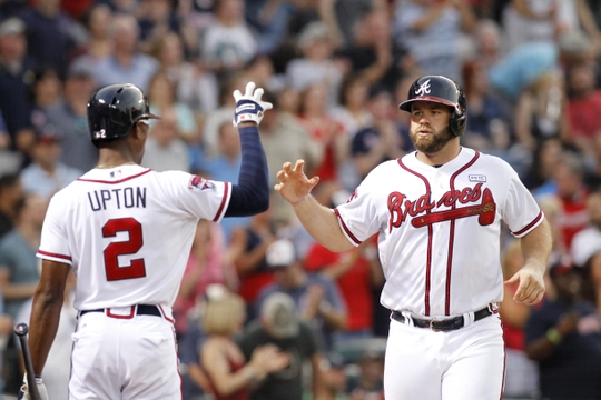 Braves break out with 4 homers, beat A's 7-2
