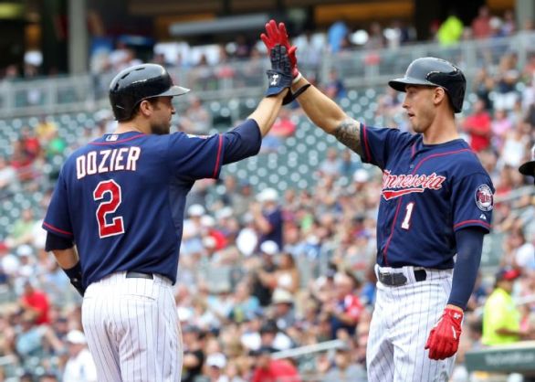 Twins' bats stay red hot in Game 1 12-4 rout over Tigers