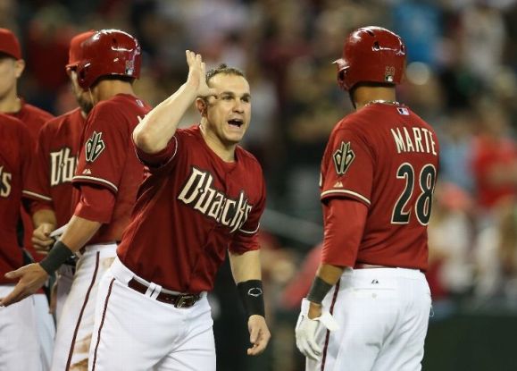 D-backs top Pirates in 10th when throw hits runner