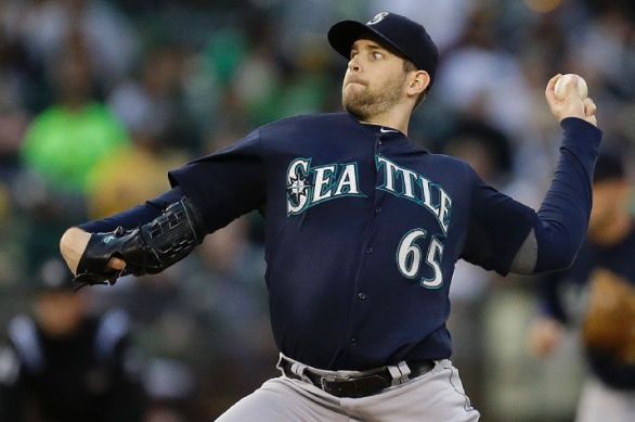 Mariners hang on to back Paxton's solid start