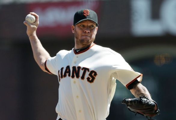 Peavy strikes out 8, pitches Giants past D-backs