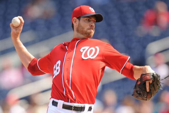 Nats grab top seed in NL on Fister's three-hit gem