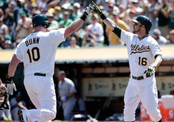 Dunn homers in 1st at-bat for A's, tops Mariners