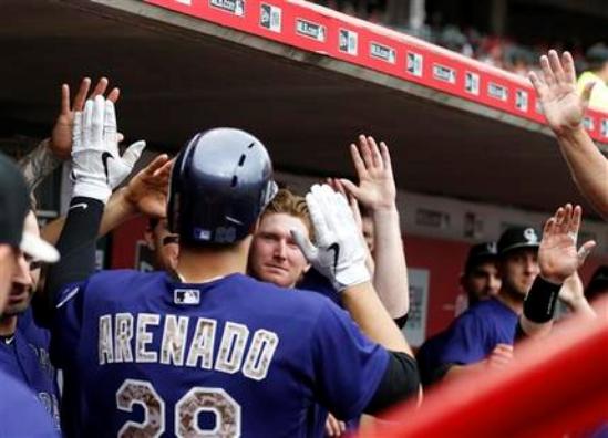 Reds lost 9th straight, Arenado leads Rockies to 5-4 win