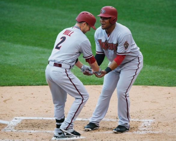 Hill propels D-backs to 13-7 win over Rockies