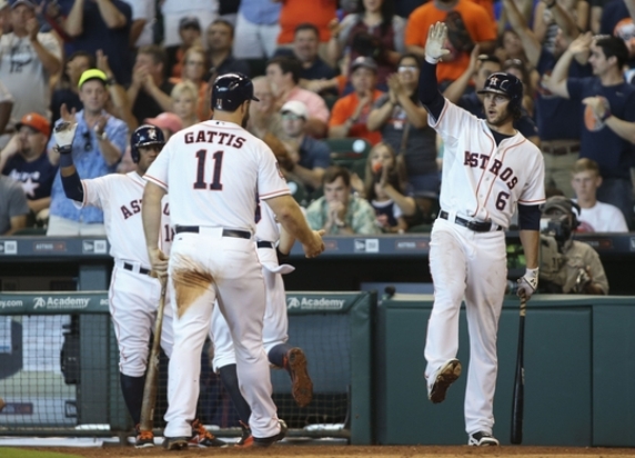 Booming bats, McCullers carry Astros past Mariners 13-0