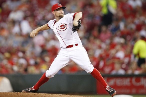 Leake pitches, hits Reds over Indians, 6-1