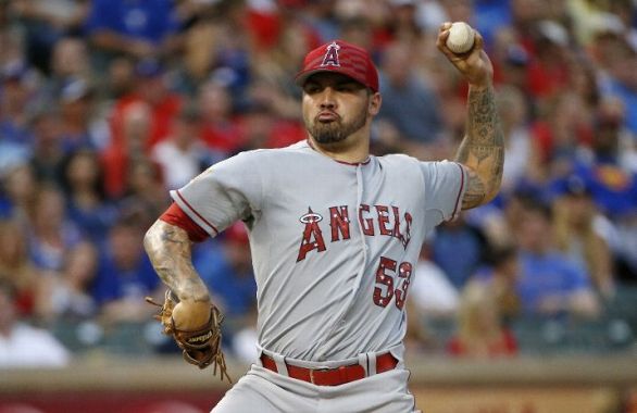 Santiago goes 7 innings in Angels' 13-0 win at Texas