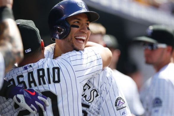 Rockies hit 5 homers, power way to 17-7 win over Reds