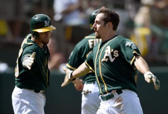 A's score 7 in seventh to beat Rays 8-2