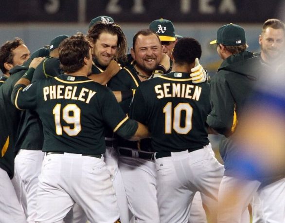 A's edge Dodgers 5-4 in 10 on Butler's walk-off double