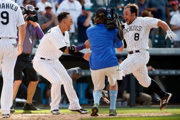 McKenry's homer in the 11th lifts Rockies past Mariners 7-5