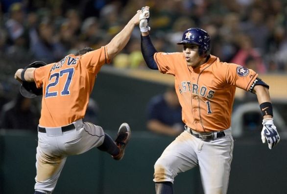 Lowrie atones for error, Astros edge A's 5-4 in 10 innings