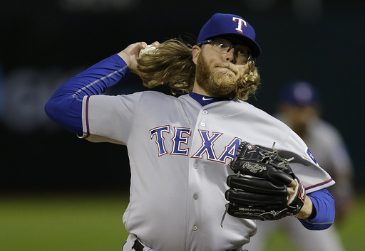 Griffin sharp in return to Oakland as Rangers top A's 7-0