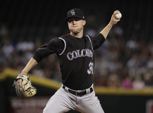Story, Freeland help Rockies beat D-backs to move into 1st