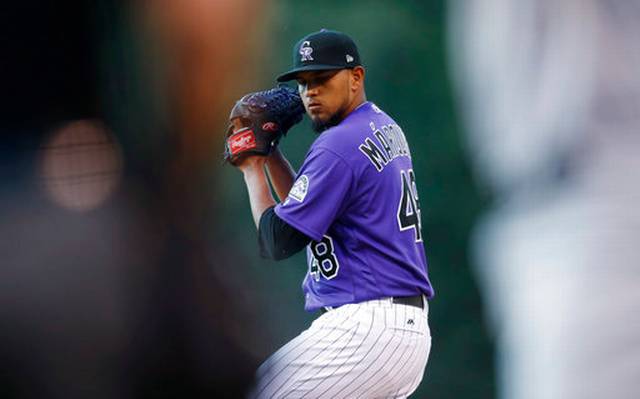Rockies back Marquez with 3 HRs, beat Brewers 8-4